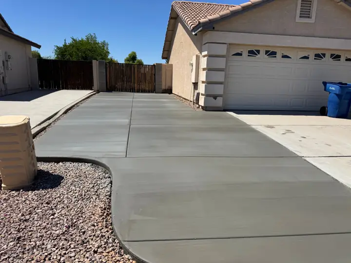 Driveway with a curved edge in Chandler, AZ, poured by Gaitan Custom Concrete