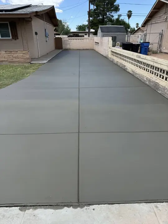 Driveway and side-yard extension in Mesa, AZ, poured by Gaitan Custom Concrete