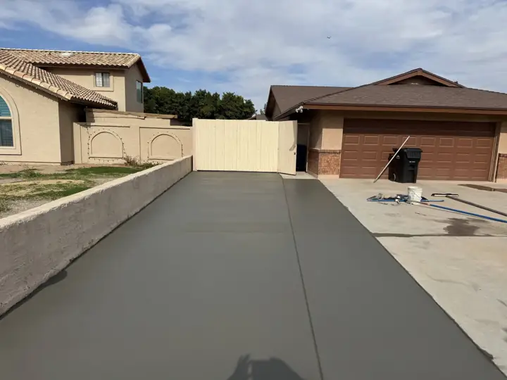 Wide driveway with side extension in Gilbert, AZ, poured by Gaitan Custom Concrete